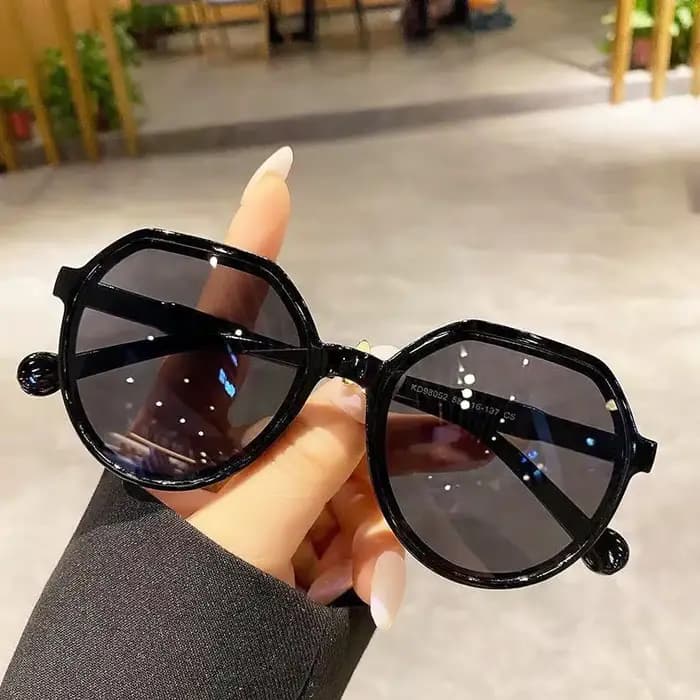 Lunettes de soleil rondes authentiques à monture épaisse