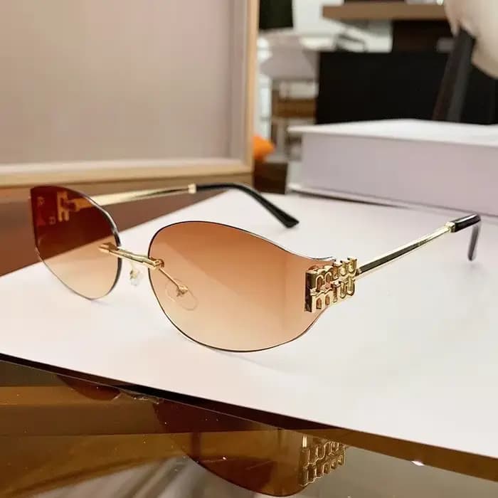 Lunettes de soleil ovales sans monture pour femmes