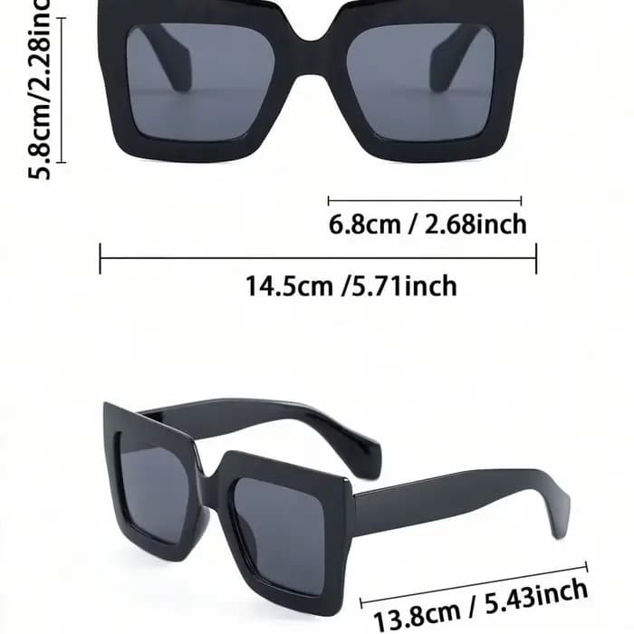 Une paire de lunettes de soleil rétro à monture large et couleur unie pour femmes