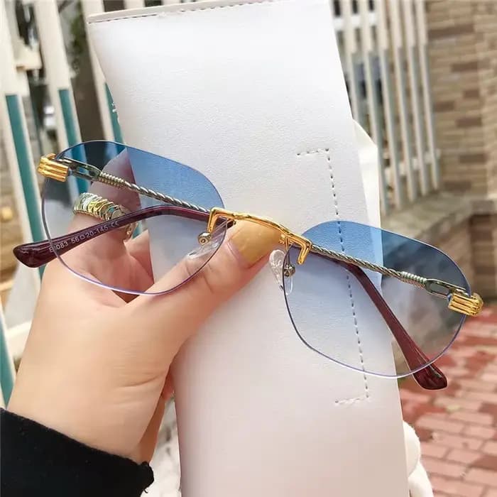 Lunettes de soleil sans cadre en métal doré pour femmes