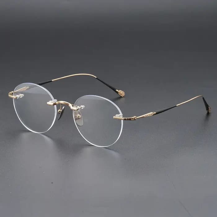 YIMARUILI Lunettes Rétro Rondes en Titane Sans Monture pour Hommes et Femmes