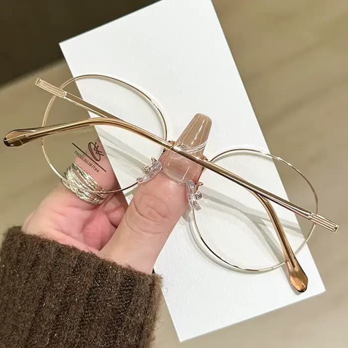 Lunettes à petite monture ovale en fil d'or littéraire
