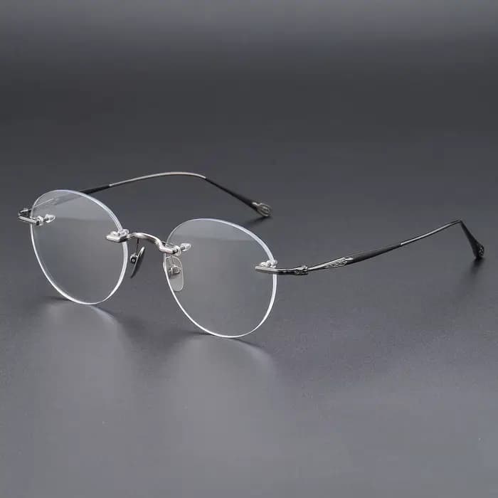 YIMARUILI Lunettes Rétro Rondes en Titane Sans Monture pour Hommes et Femmes, Ultra Légères, Tendanc